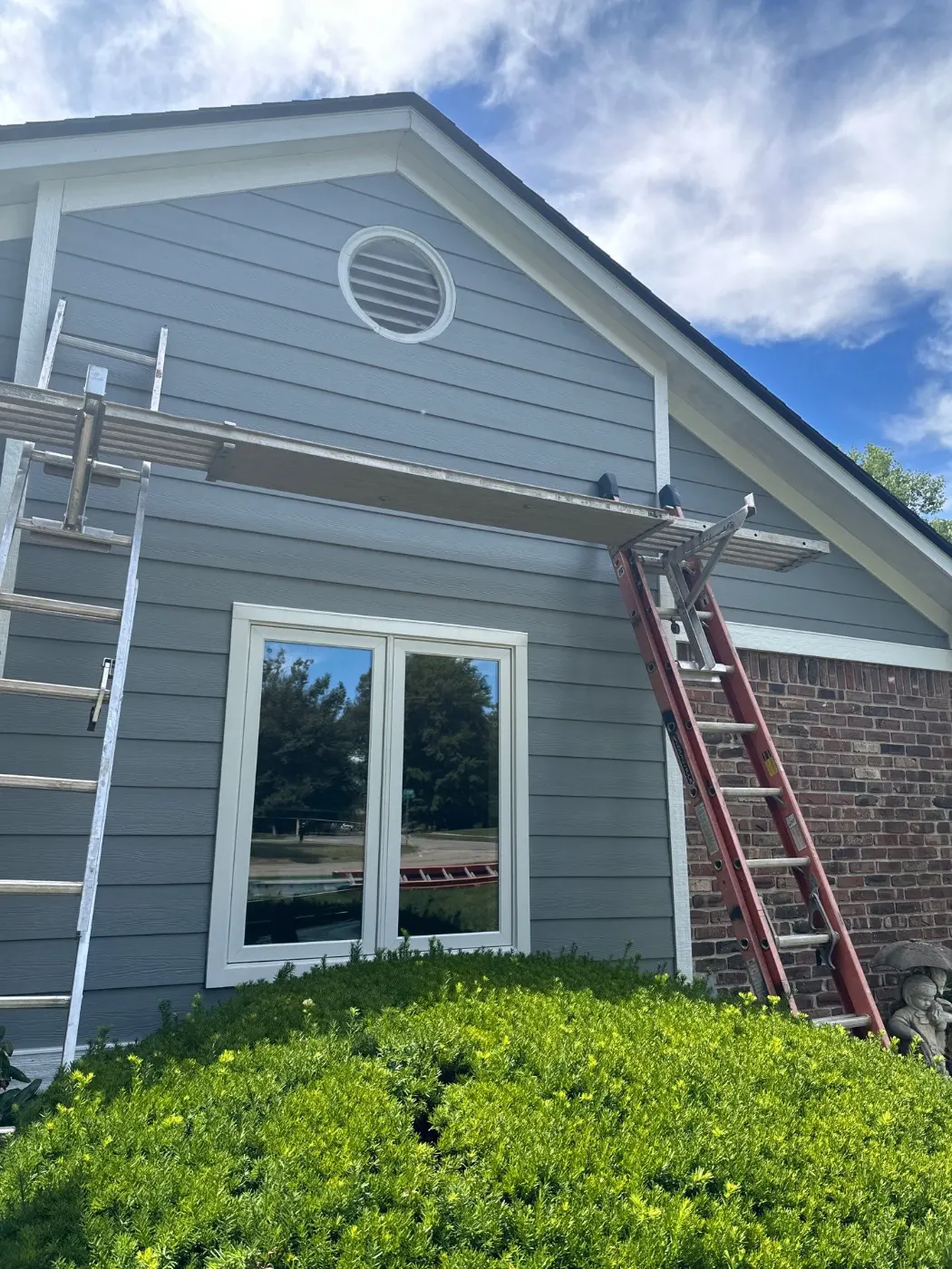 Siding installation documented in Bentley Oaks